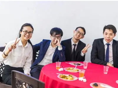 Receptionist greeting client at front desk